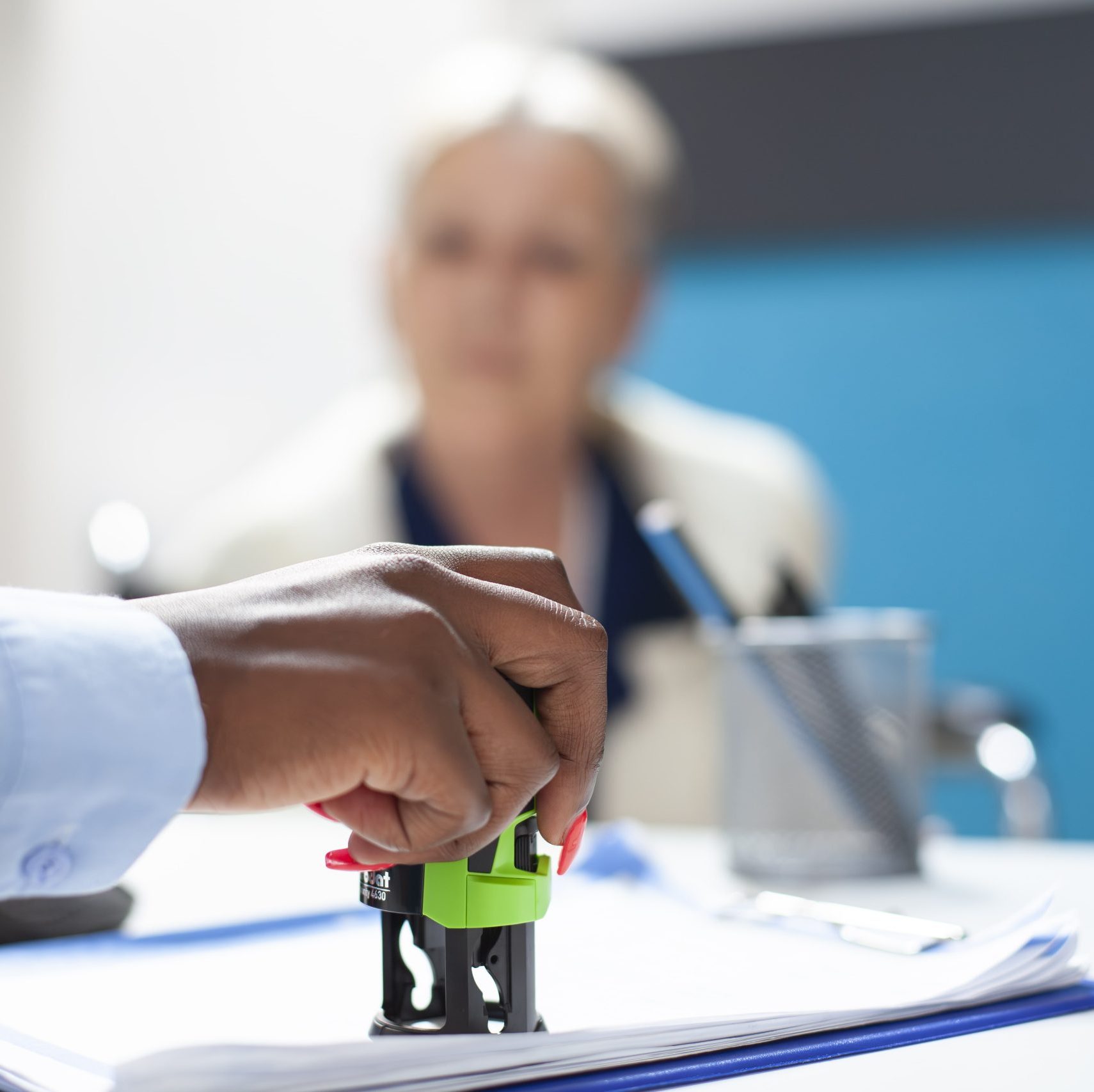 doctor using stamp patient document min scaled e1760201446650